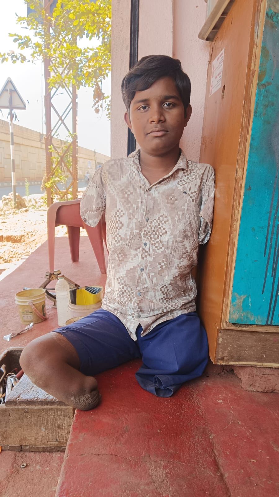 Young boy receiving mobility support